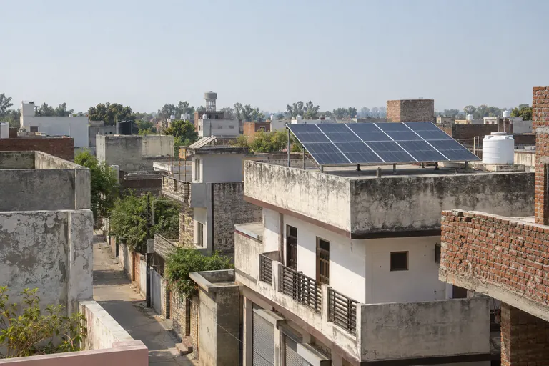 Architectural 3D illustration of a solar rooftop among Aligarh homes and workshops